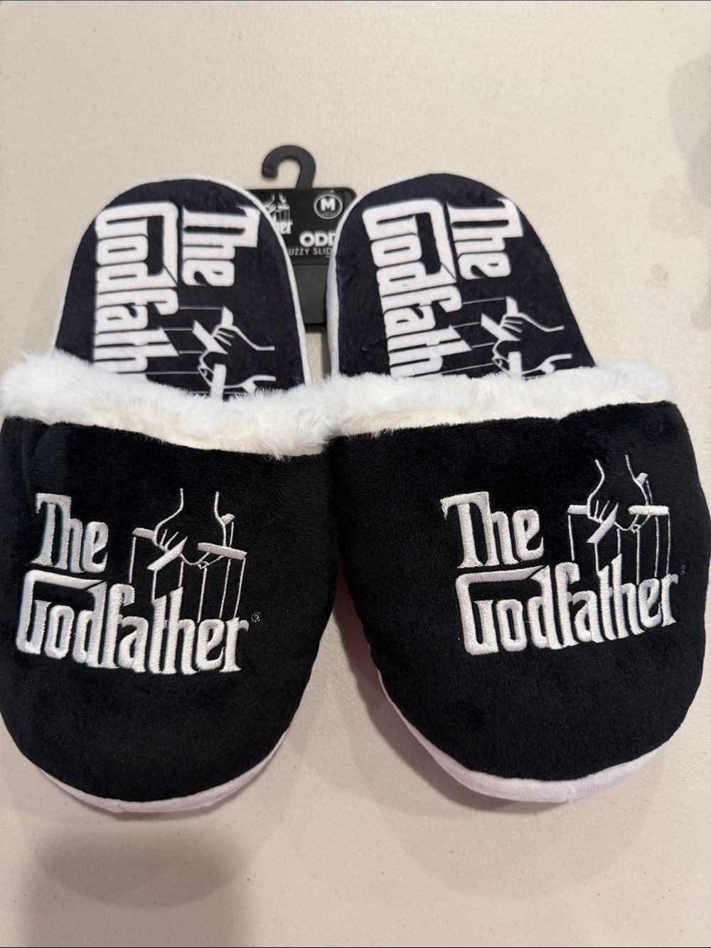 The Godfather men size medium fits men 9-10 Black and white Fuzzy Slides.